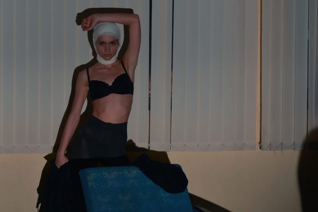 A woman posing with her underwear on