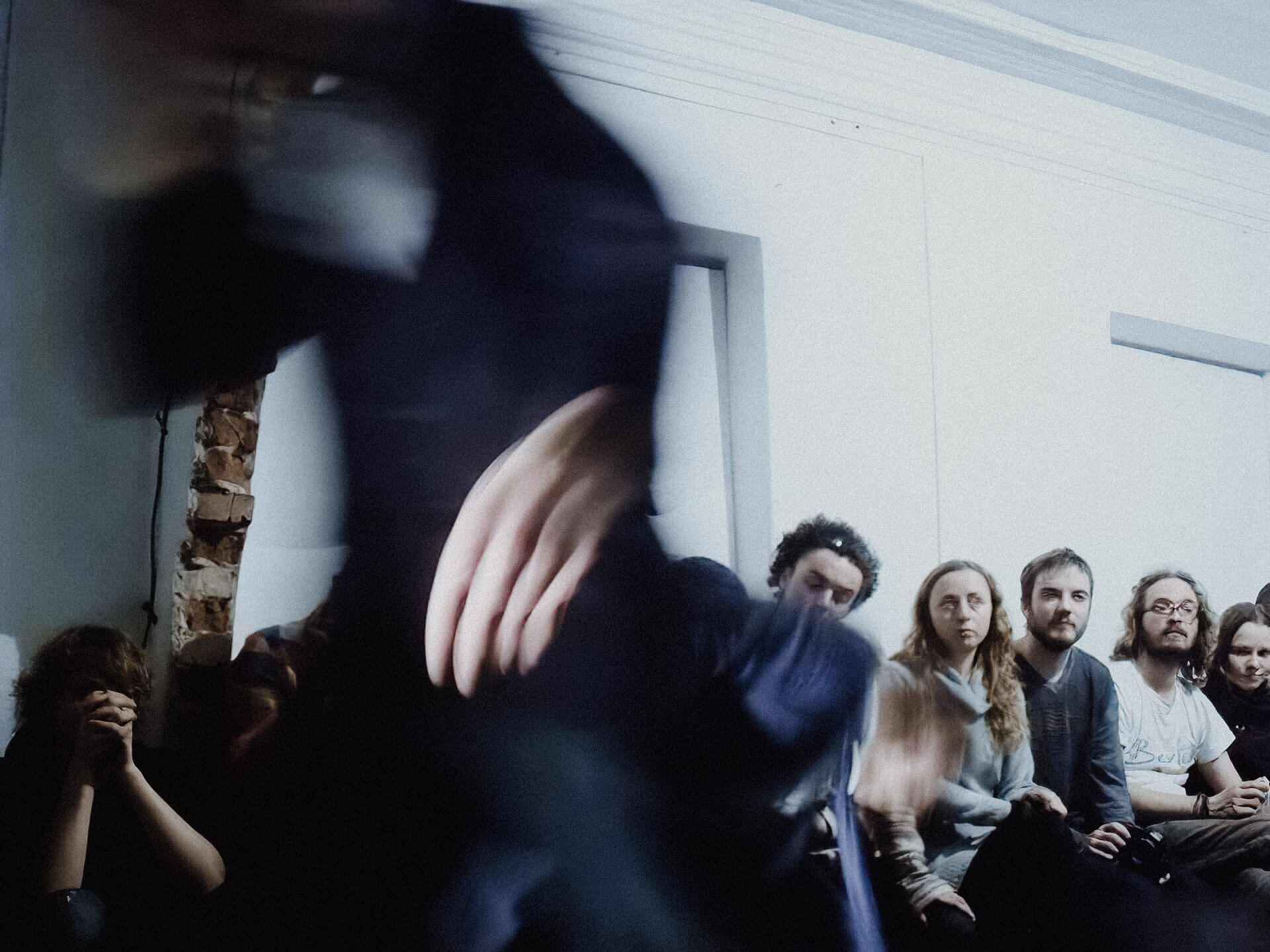 Blurry image of a performer moving. The movement is so fast that it is hard to tell what is happening.